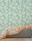 Removable wall covering with a pastel mint base and hand-drawn white floral daisy patterns. - Chalky Meadow