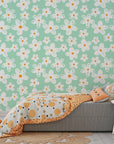 Removable wall covering with a pastel mint base and hand-drawn white floral daisy patterns. - Chalky Meadow