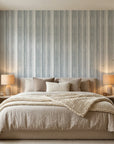 Chambray Ticking soft blue striped wallpaper in a warm and inviting living room