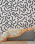 Removable peel and stick wallpaper with a classic black and white abstract Memphis design of lines and dots - Chaotic Curves
