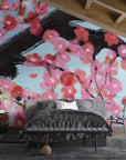 Pink and coral Cherry Blossoms wallpaper with black branches on blue background in modern bedroom