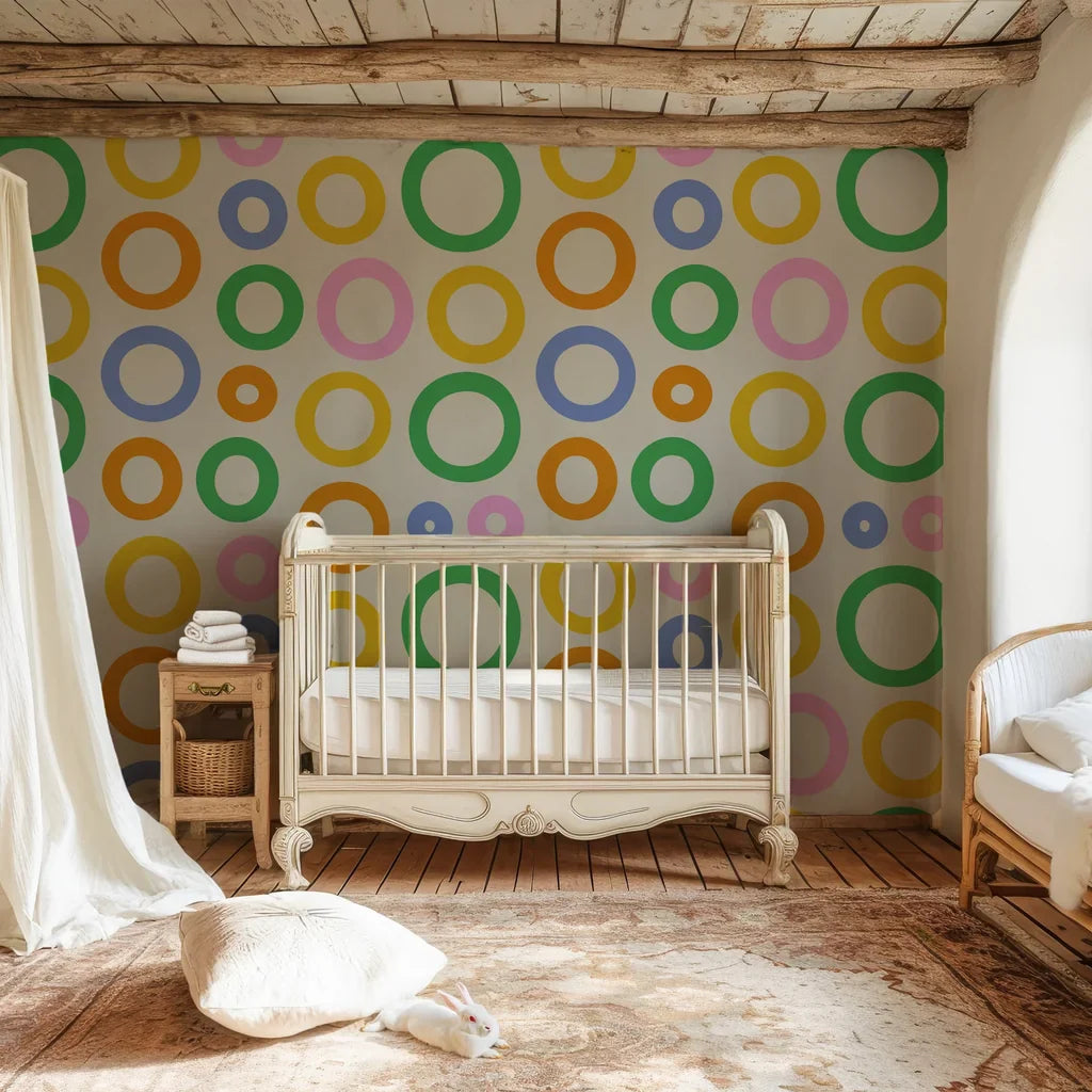 Vibrant concentric rings in a variety of hues overlapping on a smooth off-white peel and stick wallpaper surface. - Chromatic Echoes