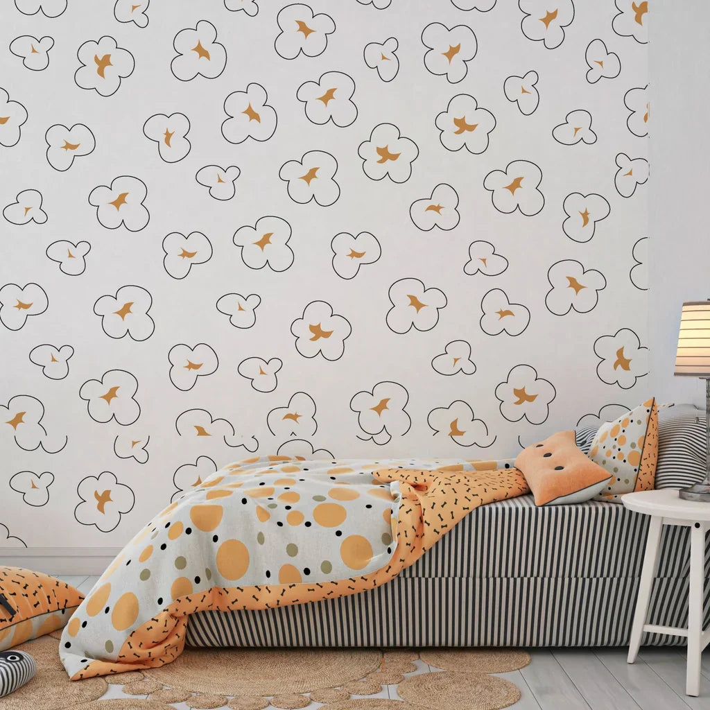 Removable wall covering showcasing a whimsical repeated pattern of fluffy white and toasted brown popcorn - Cinema Swirl
