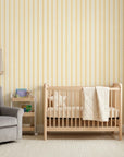 Citrine Column yellow striped peel and stick wallpaper as a feature wall in a bright home office