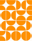 Self-adhesive wallpaper featuring a mid-century modern, orange half-circle geometric design (Citrus Grid)