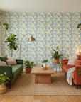 Citrus Splash playful blue floral wallpaper in a warm and inviting living room
