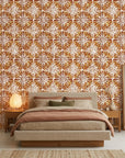 Clay Burst rustic orange floral wallpaper adding character to a cozy bedroom