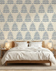 Clipped Dreams blue botanical tree wallpaper adding character to a cozy bedroom