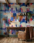 Cobalt Fragments blue and blush abstract wallpaper adding character to a cozy bedroom