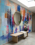 Cobalt Fragments blue and blush abstract wallpaper as a feature wall in a bright home office
