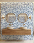 Cobalt Leaf blue botanical peel and stick wallpaper as a feature wall in a bright home office