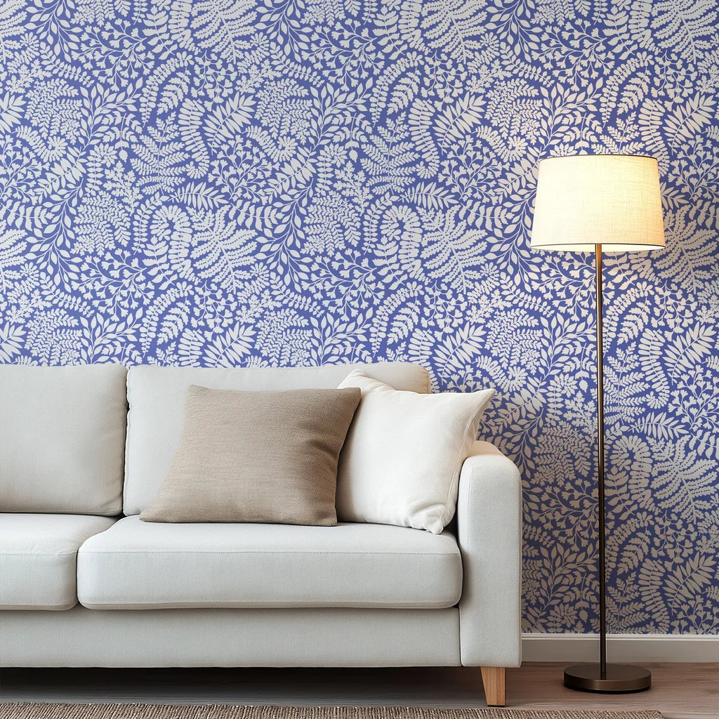 Leaf shadows in a moody cobalt hue fashion a lush, expansive, and immersive forest wall