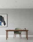 Cobalt Grain grey woven texture wallpaper as a feature wall in a bright home office