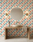 Coral Cove playful coral and blue wallpaper creating ambiance in a serene bathroom