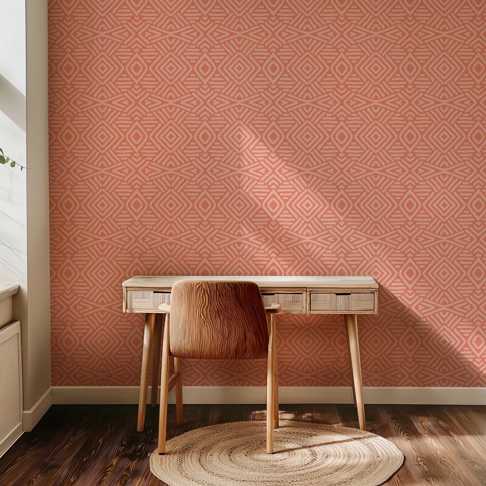 Coral geometric wallpaper with hand-drawn line patterns forming a soft, symmetrical abstract design.