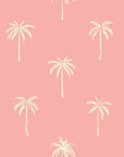 Minimalist palm tree wallpaper in shades of pink and cream with a peel and stick backing