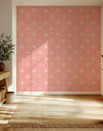 Minimalist palm tree wallpaper in shades of pink and cream with a peel and stick application