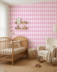 Cotton Candy pink gingham wallpaper in a warm and inviting living room