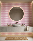 Cotton Candy pink gingham wallpaper creating ambiance in a serene bathroom