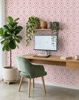 Crimson Echo elegant red geometric wallpaper adding character to a cozy bedroom