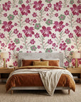 Crimson Grove magenta and green textured ikat floral wallpaper adding character to a cozy bedroom