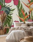 Vibrant red hibiscus flowers and orange bird of paradise plants featured on adhesive tropical wallpaper