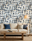 Crosshatch Canvas navy blue and beige abstract brushstroke wallpaper in a warm and inviting living room