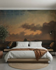 Moody sunset sky with layered clouds on Deep Forest peel and stick wallpaper behind modern bedroom