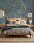 Deep Loom textured blue abstract wallpaper adding character to a cozy bedroom