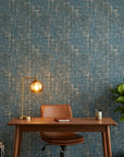 Deep Loom textured blue abstract wallpaper as a feature wall in a bright home office