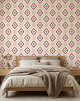 Desert Compass red geometric peel and stick wallpaper adding character to a cozy bedroom