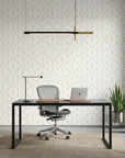 Desert Filigree gold geometric cube wallpaper as a feature wall in a bright home office