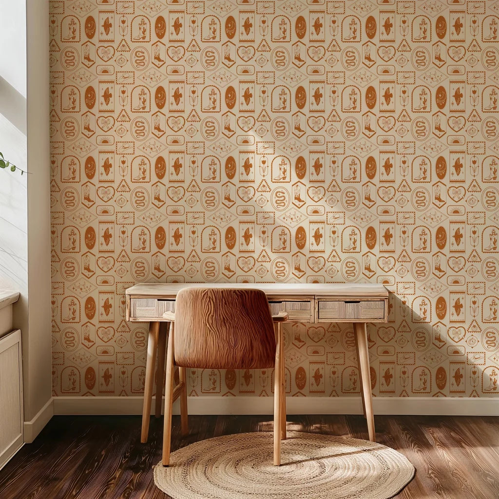 Patterned wallpaper decorated with classic Frontier symbols: horseshoes, boots, snakes, and moons, set against desert imagery and colored in dusty orange and clay shades