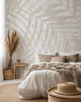 Muted, stylized wallcovering showing overlapping, hand-illustrated lines of palm fronds, resulting in a gentle, patterned texture