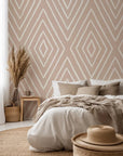 Hand-sketched white lines compose a repeating diamond structure on this neutral, soft beige wall treatment