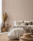 Neutral polka dot wallpaper with soft white hand-painted dots arranged in a subtle grid on a warm beige background.