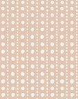 A wallpaper featuring a warm tan base adorned with soft white, hand-painted polka dots placed in a loose grid pattern