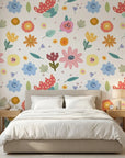 Dotted Bliss white whimsical folk art floral wallpaper adding character to a cozy bedroom