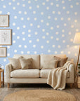 Dream Drops light blue polka dot wallpaper in a warm and inviting living room