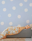 Pale blue wallpaper featuring organic hand-painted white spots - Dream Drops
