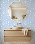 Dream Drops light blue polka dot wallpaper creating ambiance in a serene bathroom