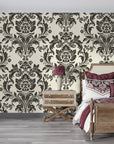 Black and cream Dreamy Fern Dial damask wallpaper in elegant bedroom with plum accents