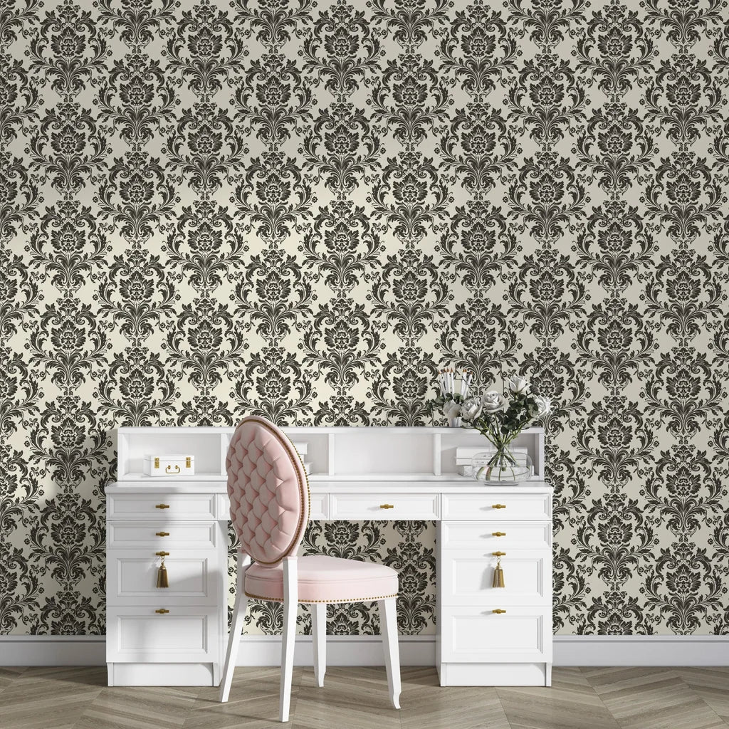 Dreamy Fern Dial damask wallpaper with charcoal florals on cream background behind white vanity desk