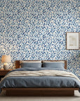 Drifting Petals blue abstract wallpaper adding character to a cozy bedroom
