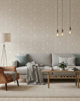 Dune Ribbon sandstone swirling line wallpaper in a warm and inviting living room