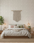 Dune Ribbon sandstone swirling line wallpaper adding character to a cozy bedroom