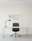 Dune Ribbon sandstone swirling line wallpaper as a feature wall in a bright home office