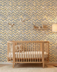 Dusk Passage grey and gold geometric wallpaper bringing warmth to a peaceful nursery
