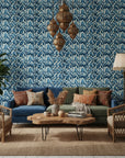 Dusk Feather indigo ikat leaf wallpaper in a warm and inviting living room