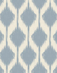 Blurred diamond motifs in soft blue, repeating across an ikat-style wall covering on a warm ivory base